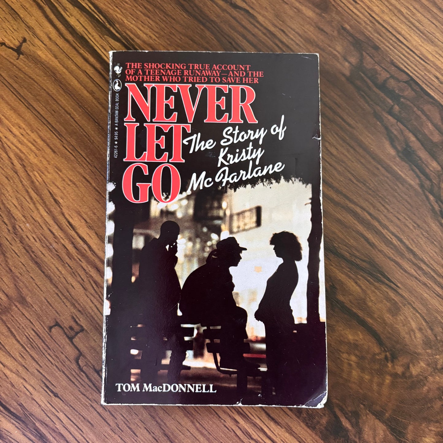 Never Let Go by Tom MacDonnell, 1988 Seal nonfiction paperback telling the true story of Kristy McFarlane and a tragic act of violence