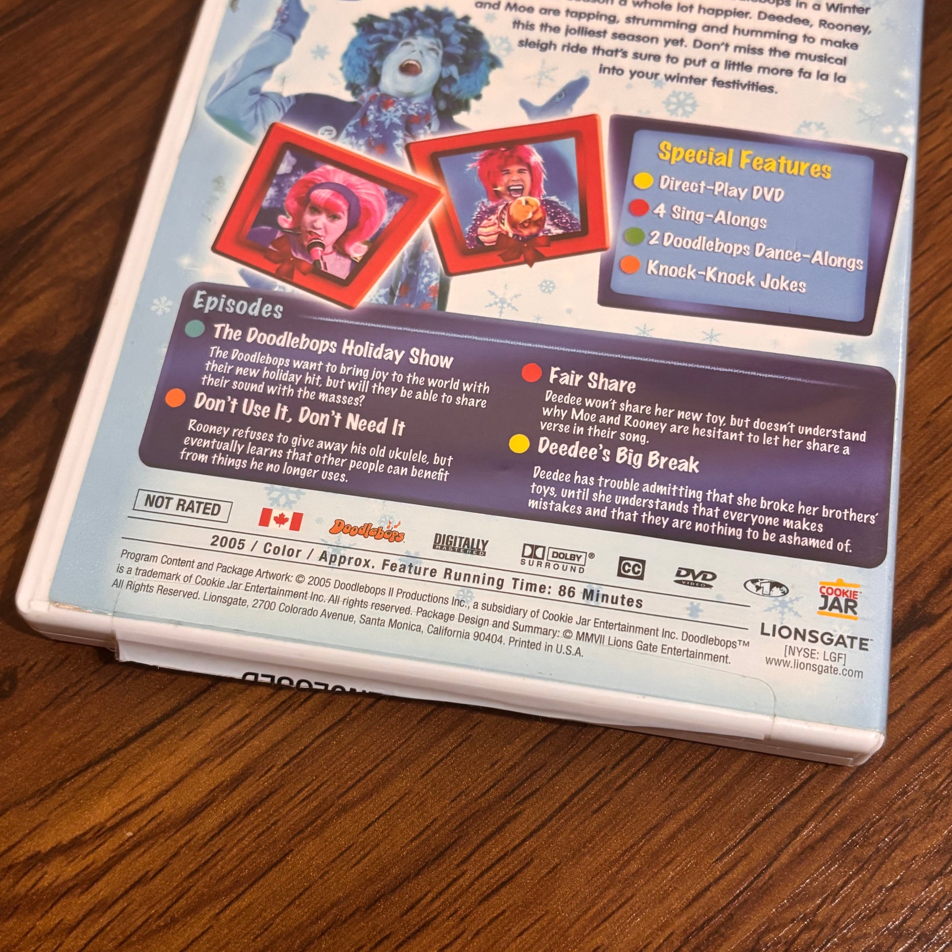 2000s kids Christmas DVD featuring The Doodlebops in Happy Doodle Holidays, a festive children’s holiday special with music, bright characters, and nostalgic TV memories.