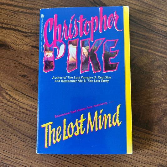 Vibrant 1995 paperback cover of The Lost Mind by Christopher Pike, with a striking combination of bright blue and pink hues, evoking mystery and tension, ideal for fans of thrilling YA horror and psychological suspense.