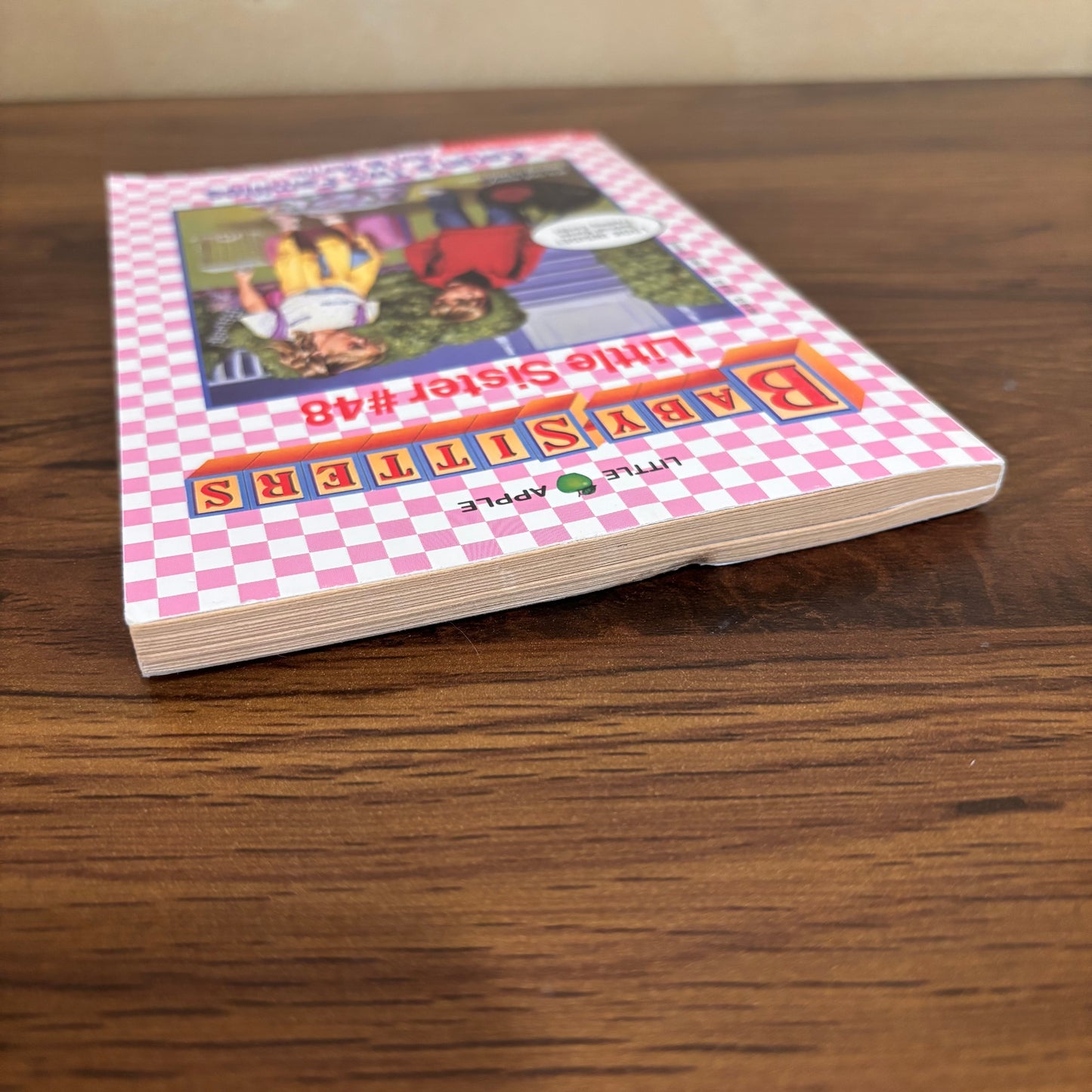 90s Baby-Sitters Little Sister book Karen’s Two Families, a nostalgic Scholastic paperback about divorce, family transition, and Karen’s struggle to share time with both parents, plus bonus trading cards inside.
