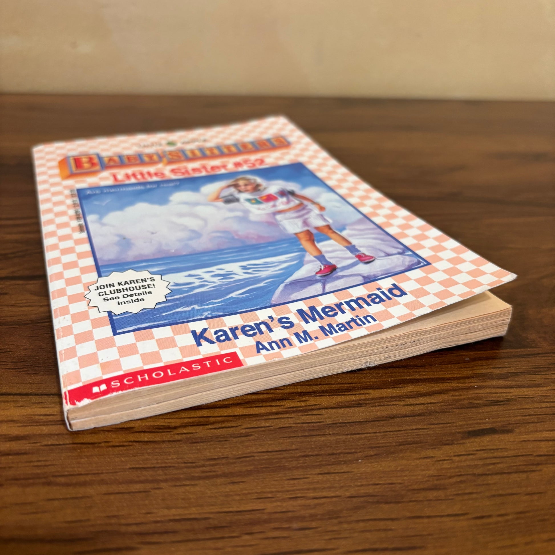90s Baby-Sitters Little Sister Karen’s Mermaid book with trading cards attached inside, a vintage Ann M. Martin paperback featuring ocean adventure, beach nostalgia, and retro Scholastic charm.