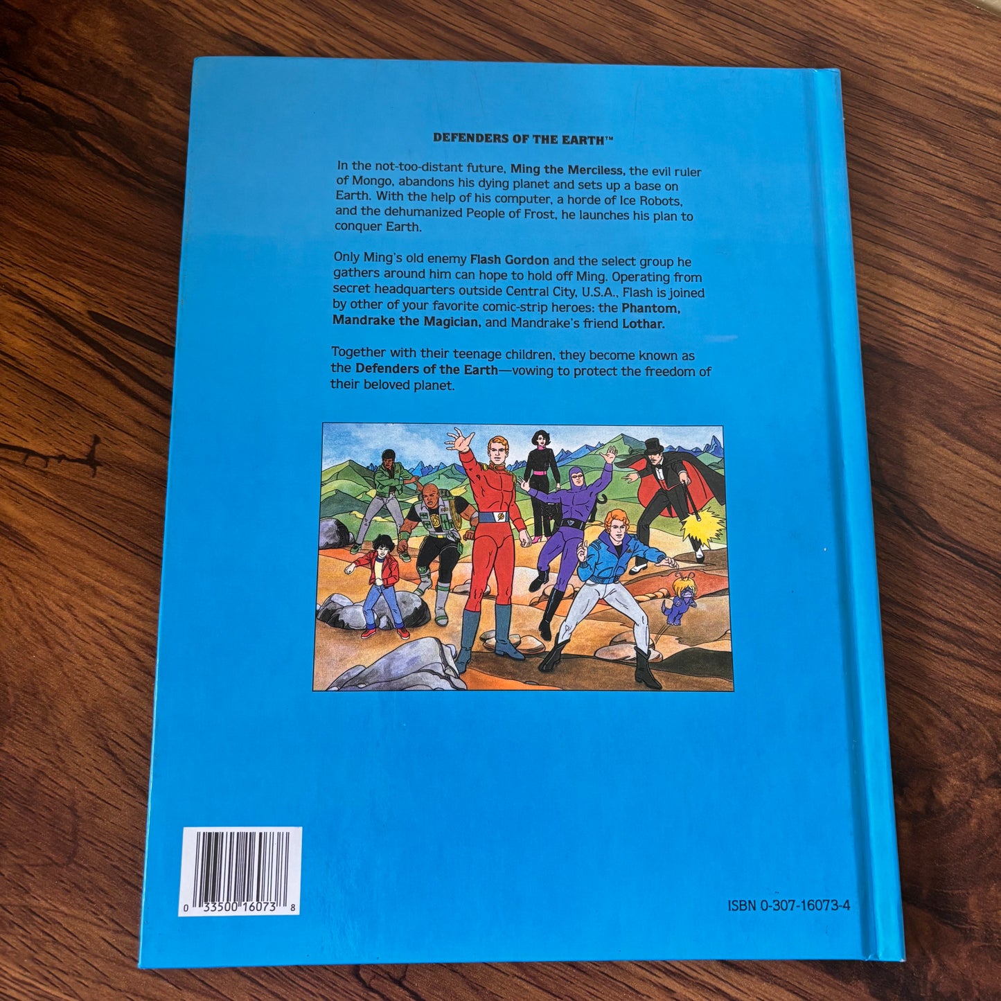 Jack C. Harris Defenders of the Earth The Frozen Fiends hardcover book, a 1986 Golden Book with colorful action artwork and retro sci-fi superhero story charm.