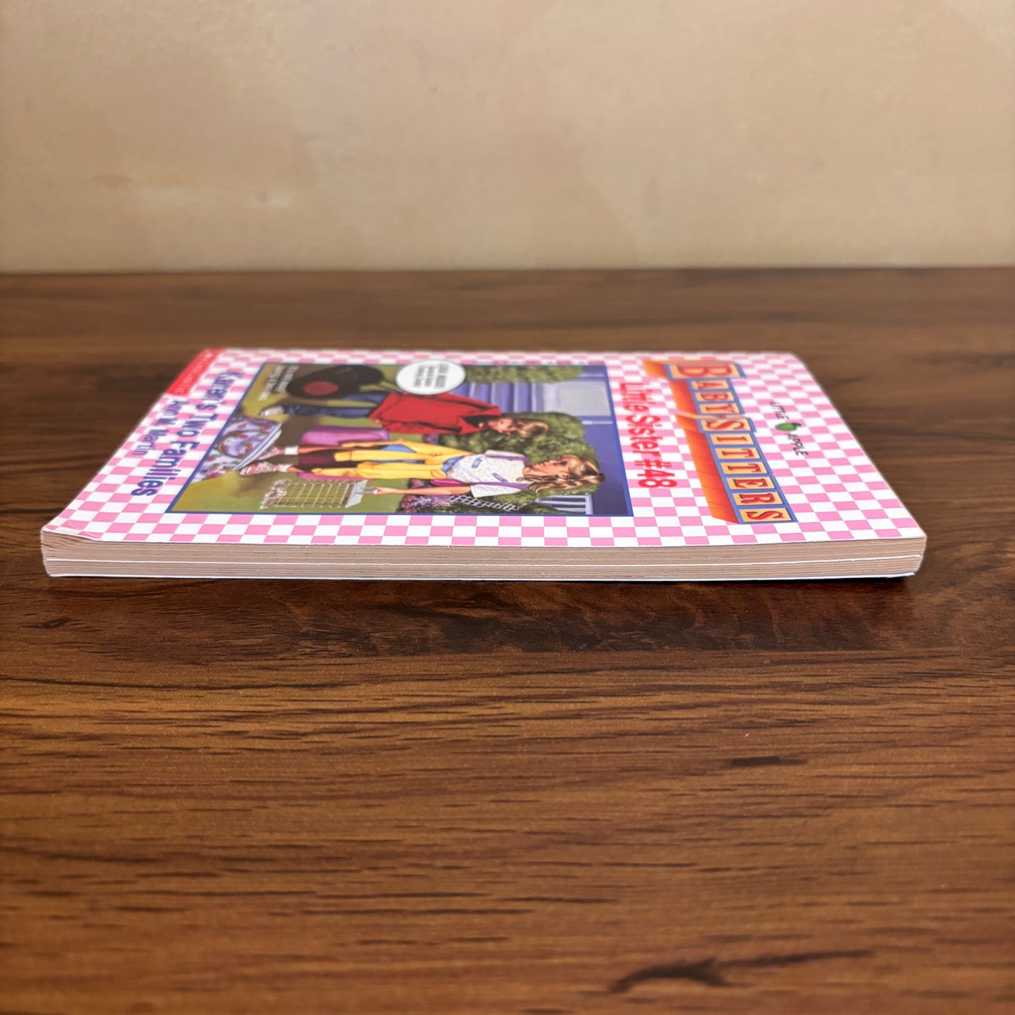 Ann M. Martin Karen’s Two Families vintage paperback, a Baby-Sitters Little Sister book about family changes, childhood feelings, and learning to belong in two homes, with original cards attached inside.