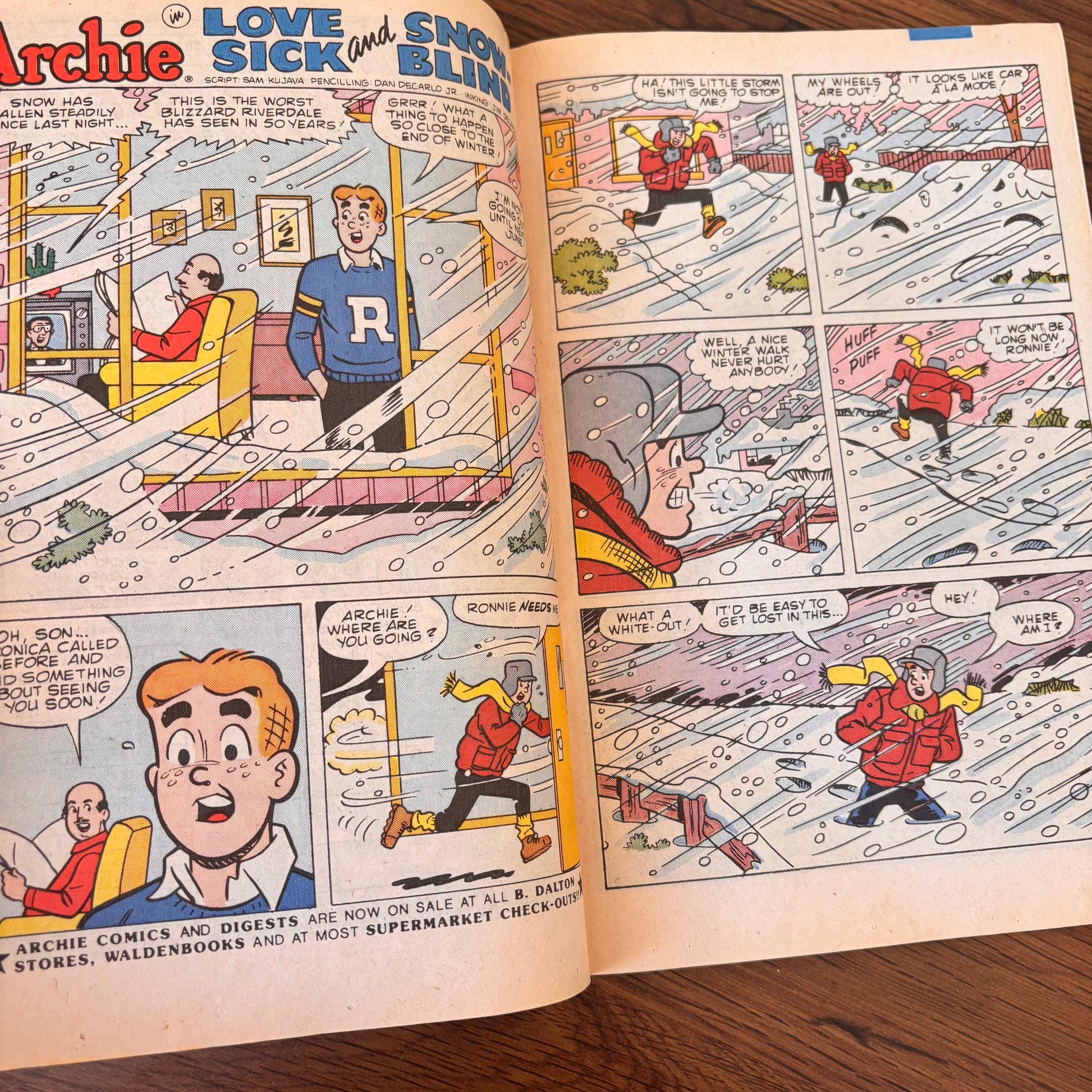 Archie comic issue 348 with a bicycle stunt cover, showing Archie riding a trick bike in safety pads while friends and adults watch in a funny outdoor scene.
