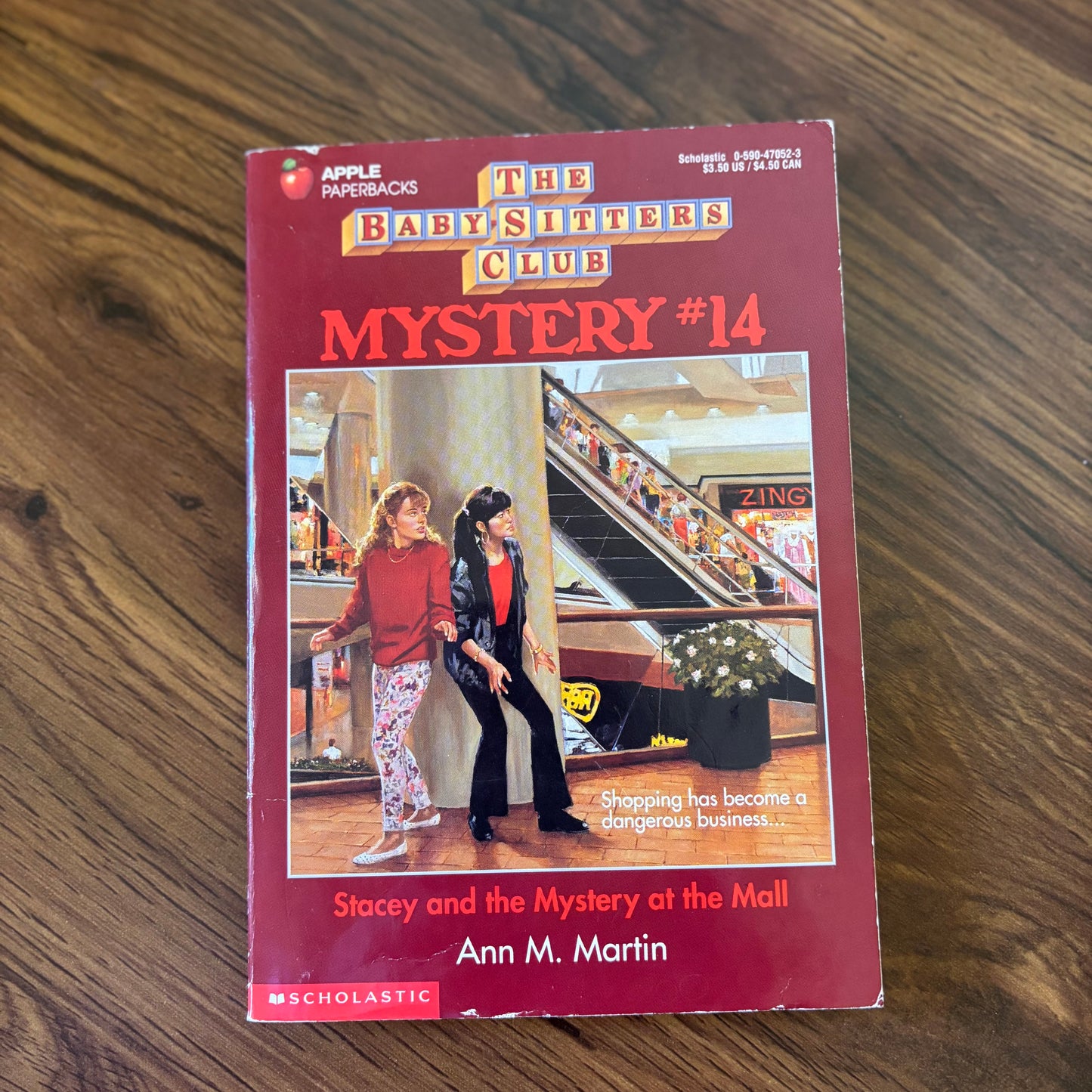 The Baby-Sitters Club Mystery #14: Stacey and the Mystery at the Mall by Ann M. Martin - 1994 Scholastic paperback edition, a suspenseful mystery where Stacey and the Baby-Sitters Club uncover strange events at the local mall.