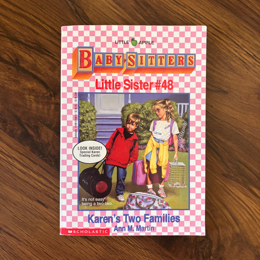 Karen’s Two Families by Ann M. Martin, Babysitters Little Sister #48 (1994). Original Scholastic Little Apple paperback edition with collectible cards included. A vintage 90s children’s book from the Babysitters Club spinoff series.