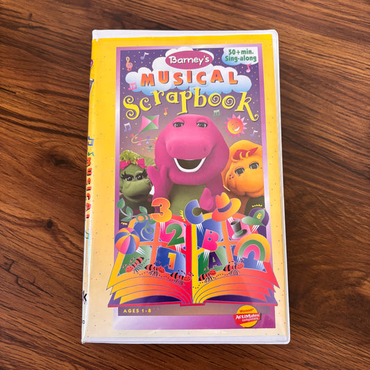 Barney Musical Scrapbook 1997 VHS featuring sing-along songs and cheerful kids music from the classic PBS series