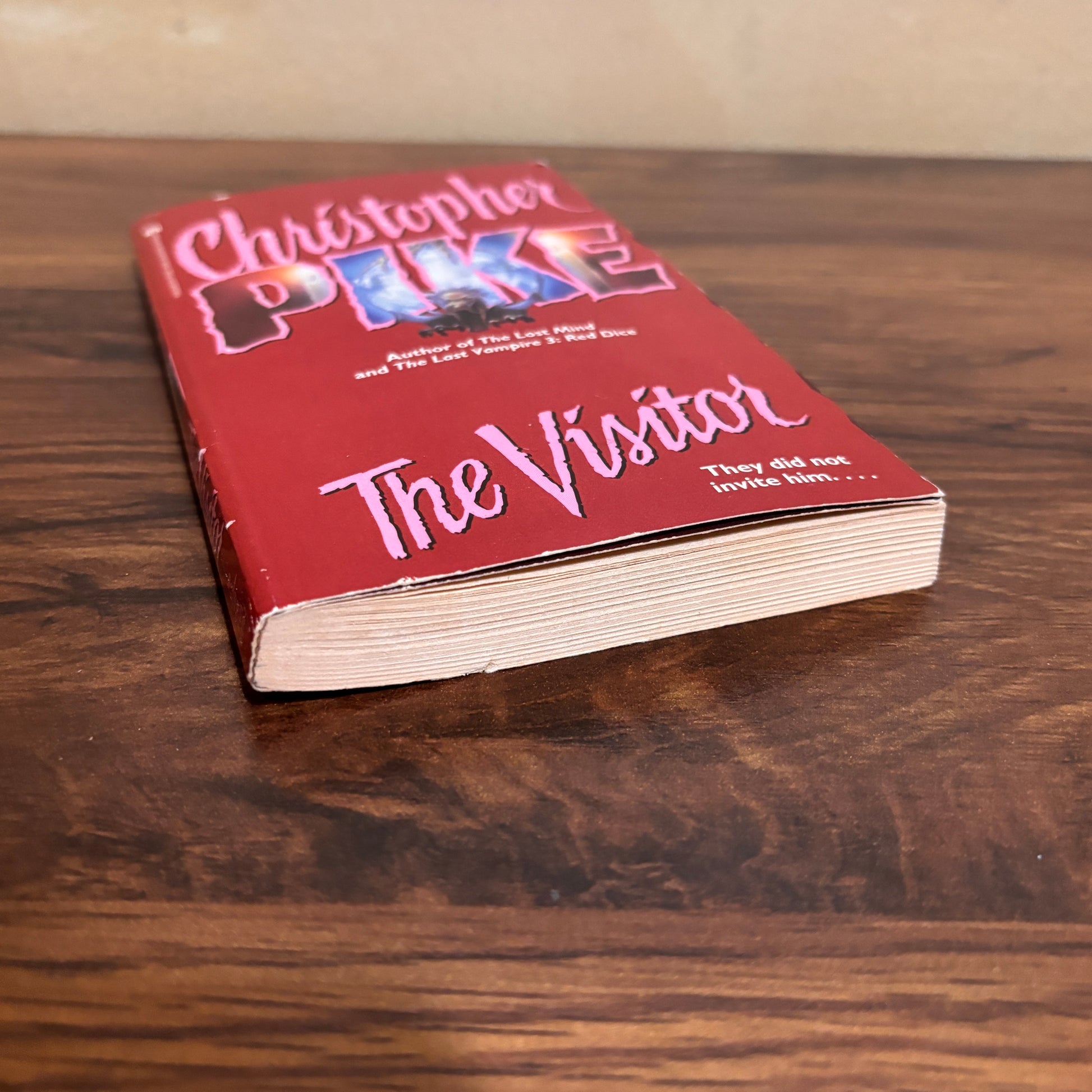 Christopher Pike vintage horror paperback titled The Visitor, featuring original red cover art and nostalgic young adult suspense appeal for retro book collectors.
