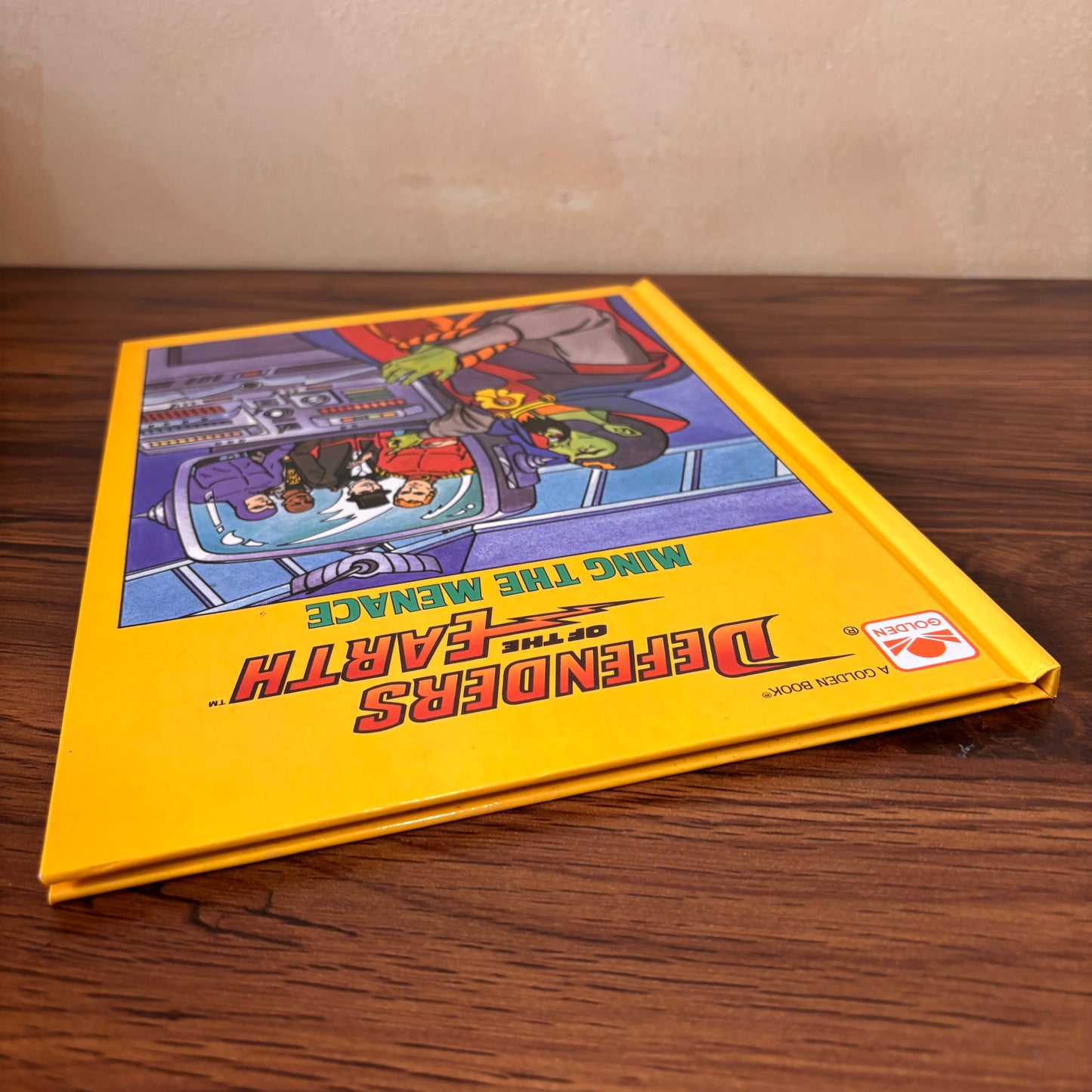 Defenders of the Earth 1986 children’s hardcover book Ming the Menace, featuring a colorful Golden Book cover, interior title page, Jim Razzi author credit, and vintage Saturday morning cartoon