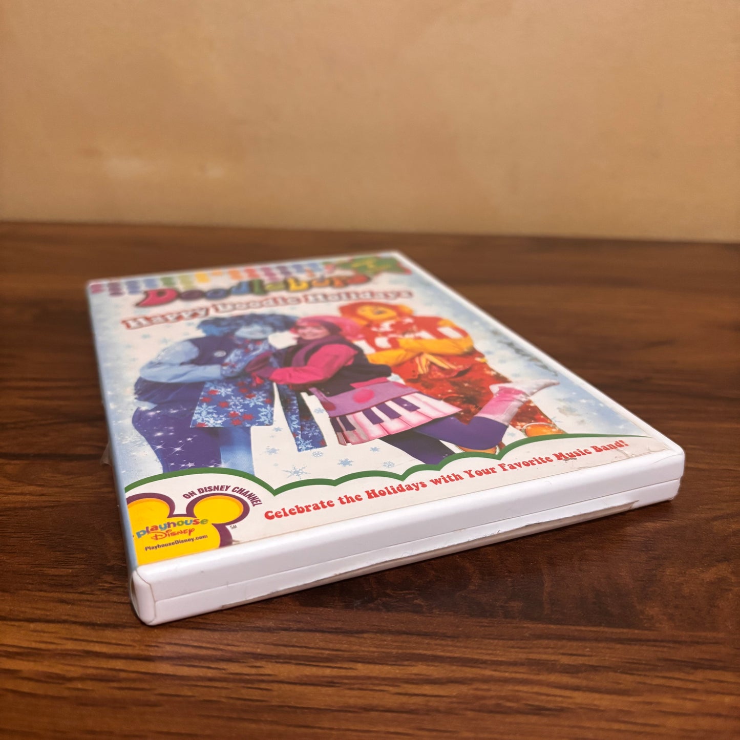 Doodlebops holiday DVD for preschool Christmas watching, featuring Happy Doodle Holidays episodes, colorful winter artwork, and nostalgic children’s music show fun.