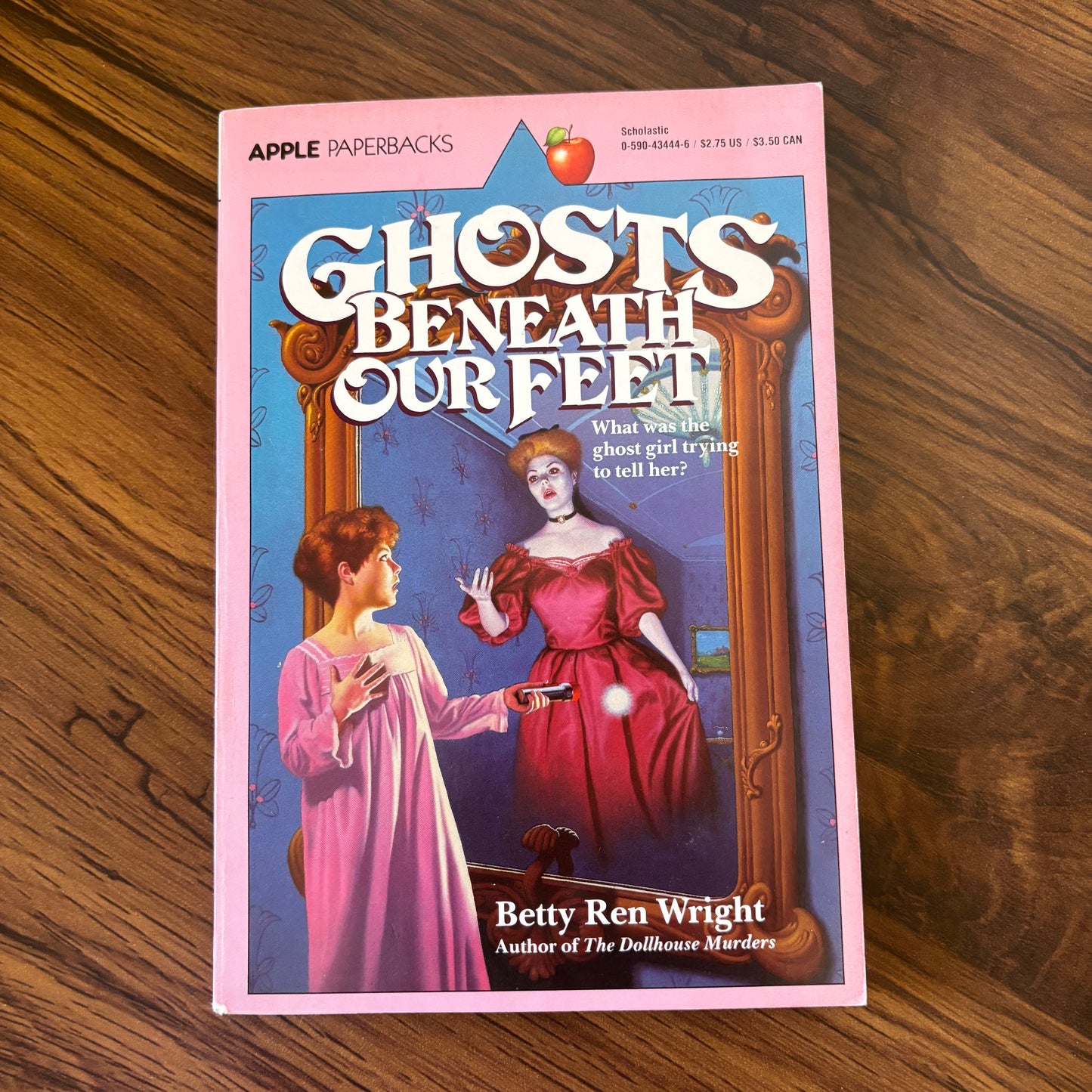 Ghosts Beneath Our Feet by Betty Ren Wright - 1984 Scholastic paperback edition, a spine-chilling tale of a young girl uncovering eerie secrets and facing supernatural forces in her new home.