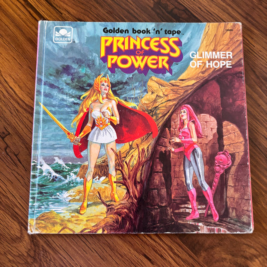 1985 Princess of Power Golden Book titled Glimmer of Hope, featuring She-Ra universe characters in a classic hardcover kids’ storybook with bright, retro 80s artwork.