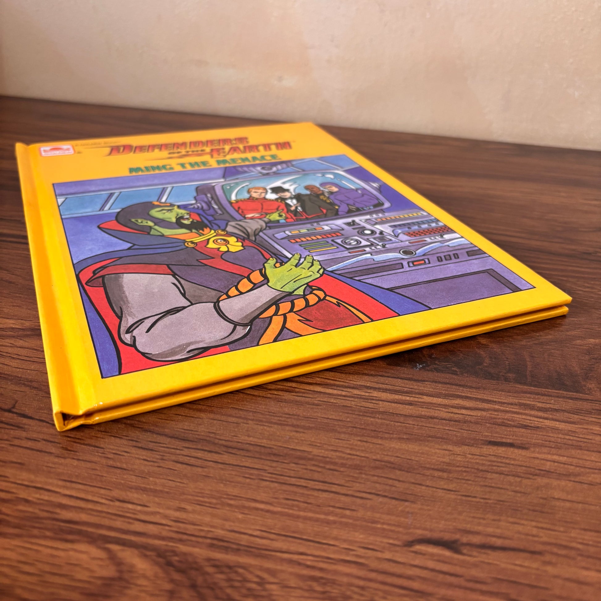 Golden Book Defenders of the Earth Ming the Menace hardcover featuring bold yellow cover art, sci-fi control panel scene, vintage cartoon characters, and 1986 children’s book nostalgia.