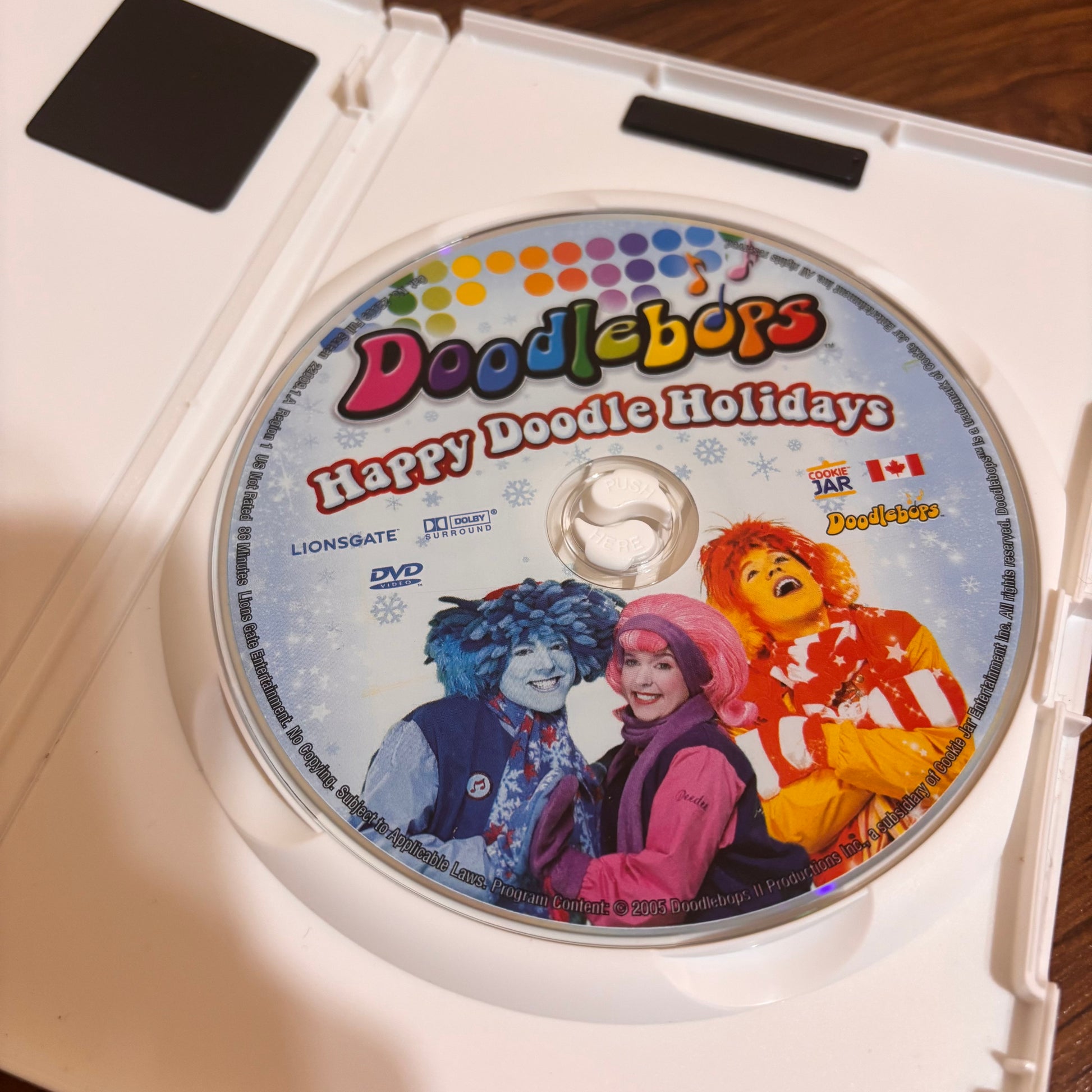 Happy Doodle Holidays Doodlebops DVD from the 2000s kids show era, featuring festive episodes, sing-along fun, and nostalgic children’s holiday entertainment.