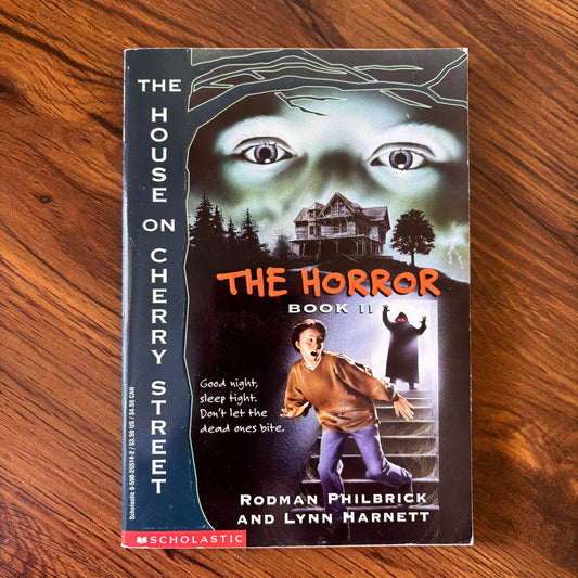 The Horror Book II: The House on Cherry Street Series  by Rodman Philbrick and Lynn Harnett (1995). A haunted-house story where the new family on Cherry Street uncovers terrifying secrets. Vintage YA horror paperback, classic 90s teen thriller.