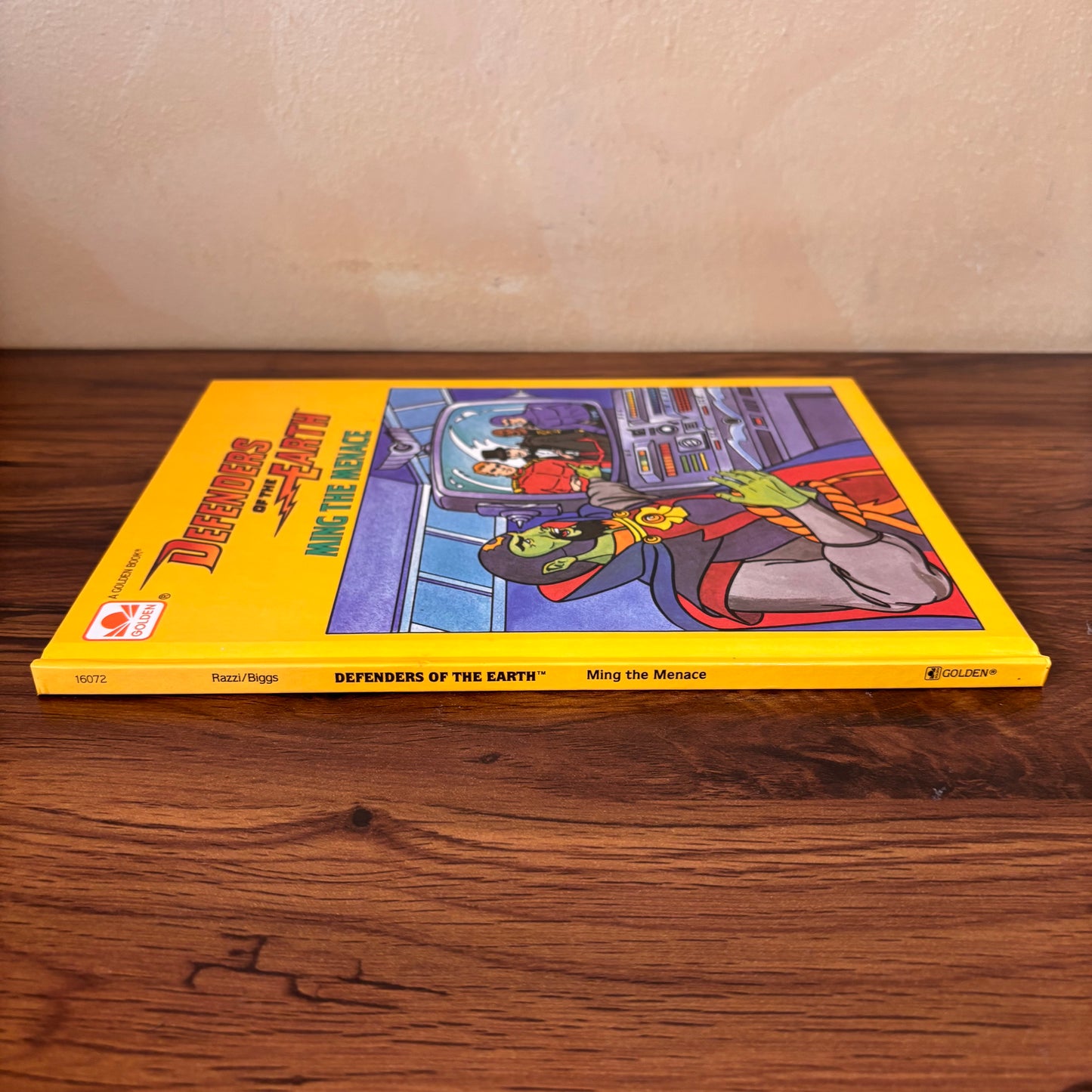 Jim Razzi Ming the Menace Defenders of the Earth hardcover book, a collectible 1986 Golden Book with Gene Biggs illustrations, retro cartoon adventure, and original title page shown inside.