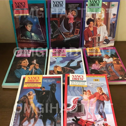 Stack of vintage Nancy Drew Mystery Stories paperbacks by Carolyn Keene, 80s and 90s Minstrel editions with illustrated covers.