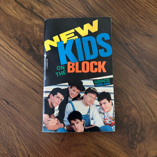Cover of New Kids on the Block by Grace Catalano, a 1989 Bantam YA biography paperback focused on teen stardom and late-1980s pop culture.