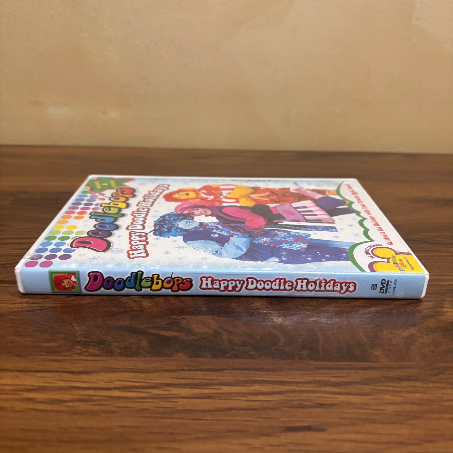 Playhouse Disney era Doodlebops Happy Doodle Holidays DVD with festive cover art, sing-along songs, and nostalgic 2000s preschool show appeal for collectors and families.