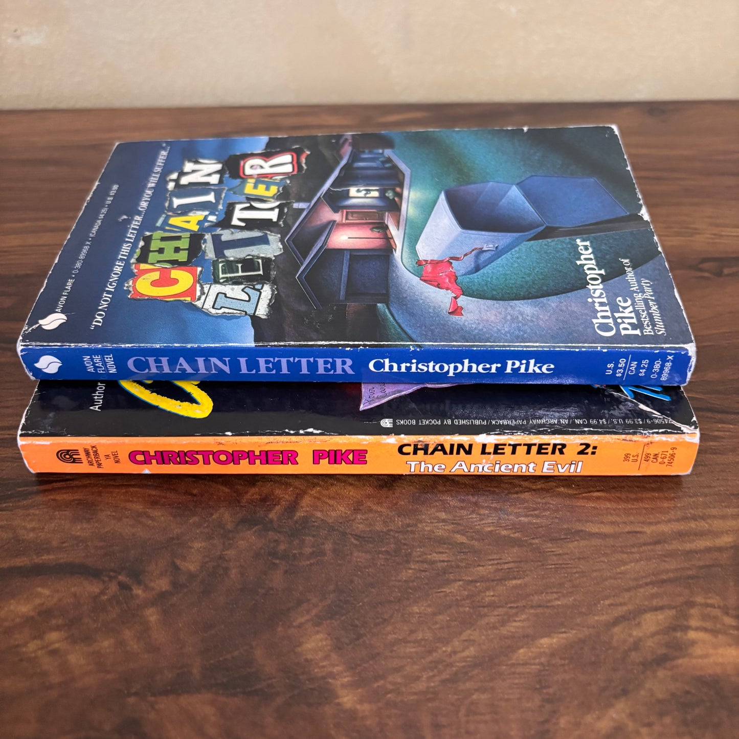 Retro horror paperback pair Chain Letter and Chain Letter 2 The Ancient Evil by Christopher Pike, a vintage young adult suspense set with chilling cover art and old school scary book nostalgia.