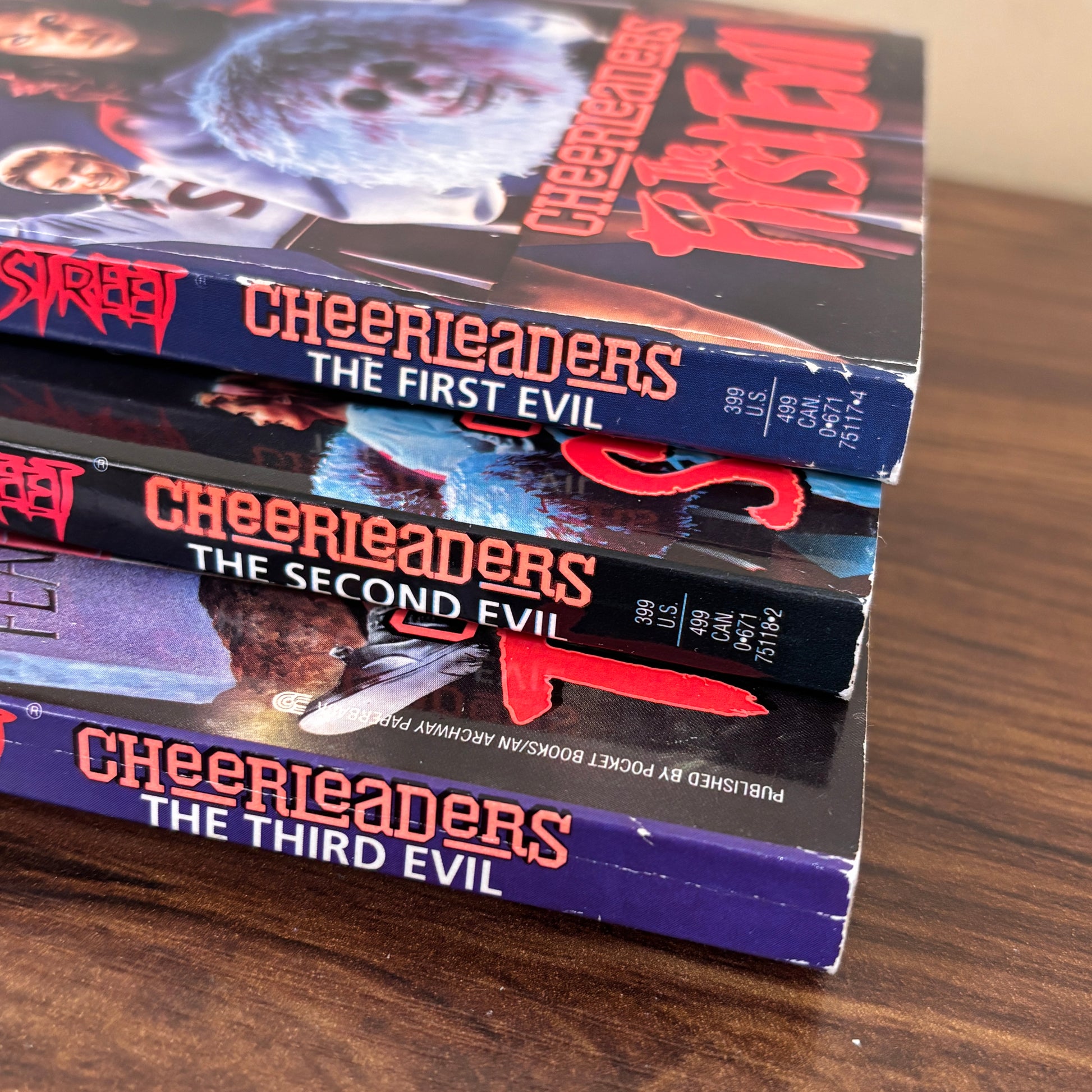 R.L. Stine Cheerleaders trilogy book set including The First Evil, The Second Evil, and The Third Evil from the Fear Street series, vintage paperback horror books with classic 90s cover artwork.