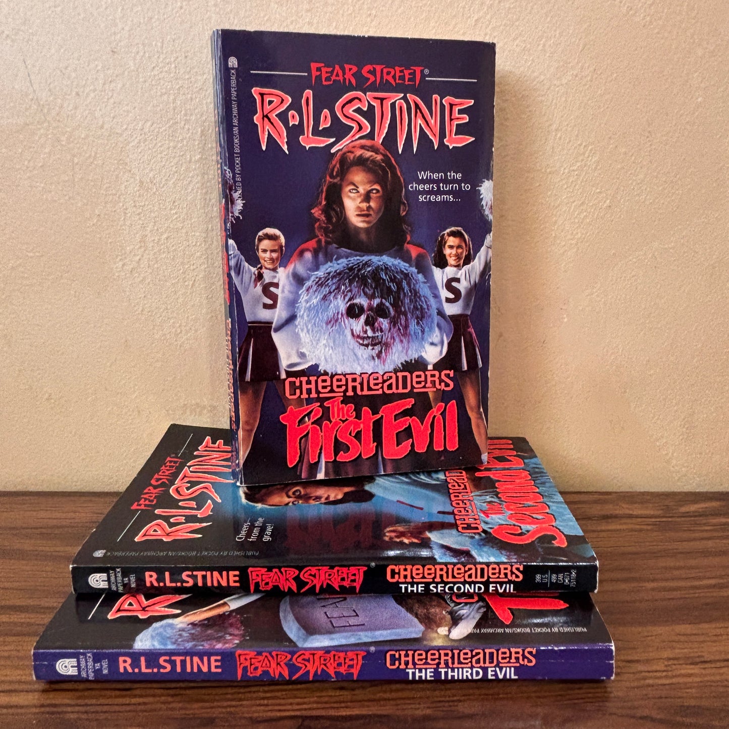 Collectible R.L. Stine Fear Street Cheerleaders paperback trilogy featuring The First Evil, The Second Evil, and The Third Evil, ideal for vintage horror book collectors and nostalgic 90s readers.