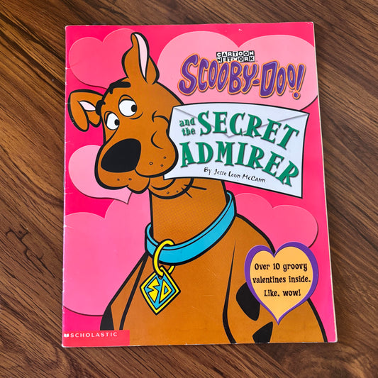 2003 Scholastic softcover book Scooby-Doo and the Secret Admirer by Jesse Leon McCann. Classic early 2000s mystery featuring the Scooby gang in a Valentine’s Day-themed adventure.