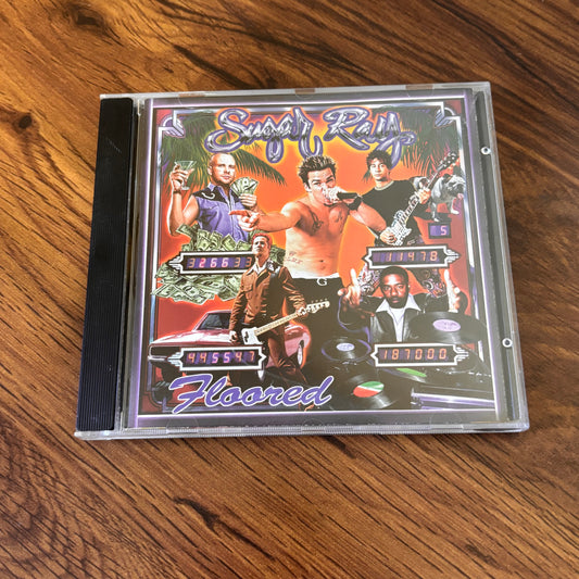 Floored by Sugar Ray (1997 CD), featuring the breakout hit “Fly” and a mix of pop-rock, rap-rock, and pure 90s beach energy. A must-have Y2K era favorite for your throwback CD stash. omgihadthat.com