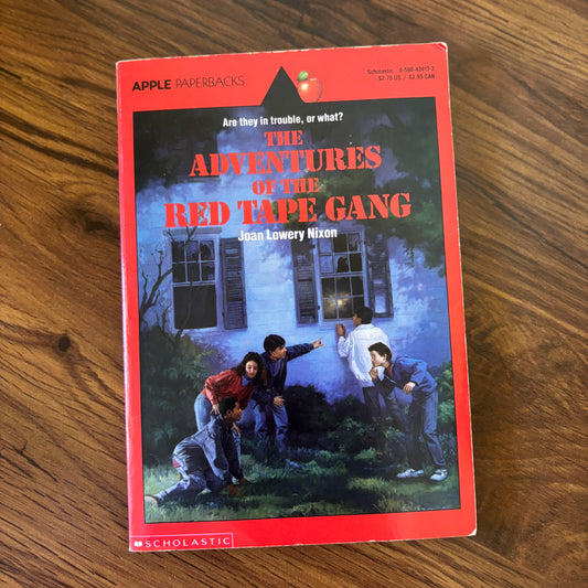 The Adventures of the Red Tape Gang by Joan Lowery Nixon - 1974 Scholastic paperback edition, a thrilling tale of young detectives solving mysteries with clever teamwork and problem-solving.