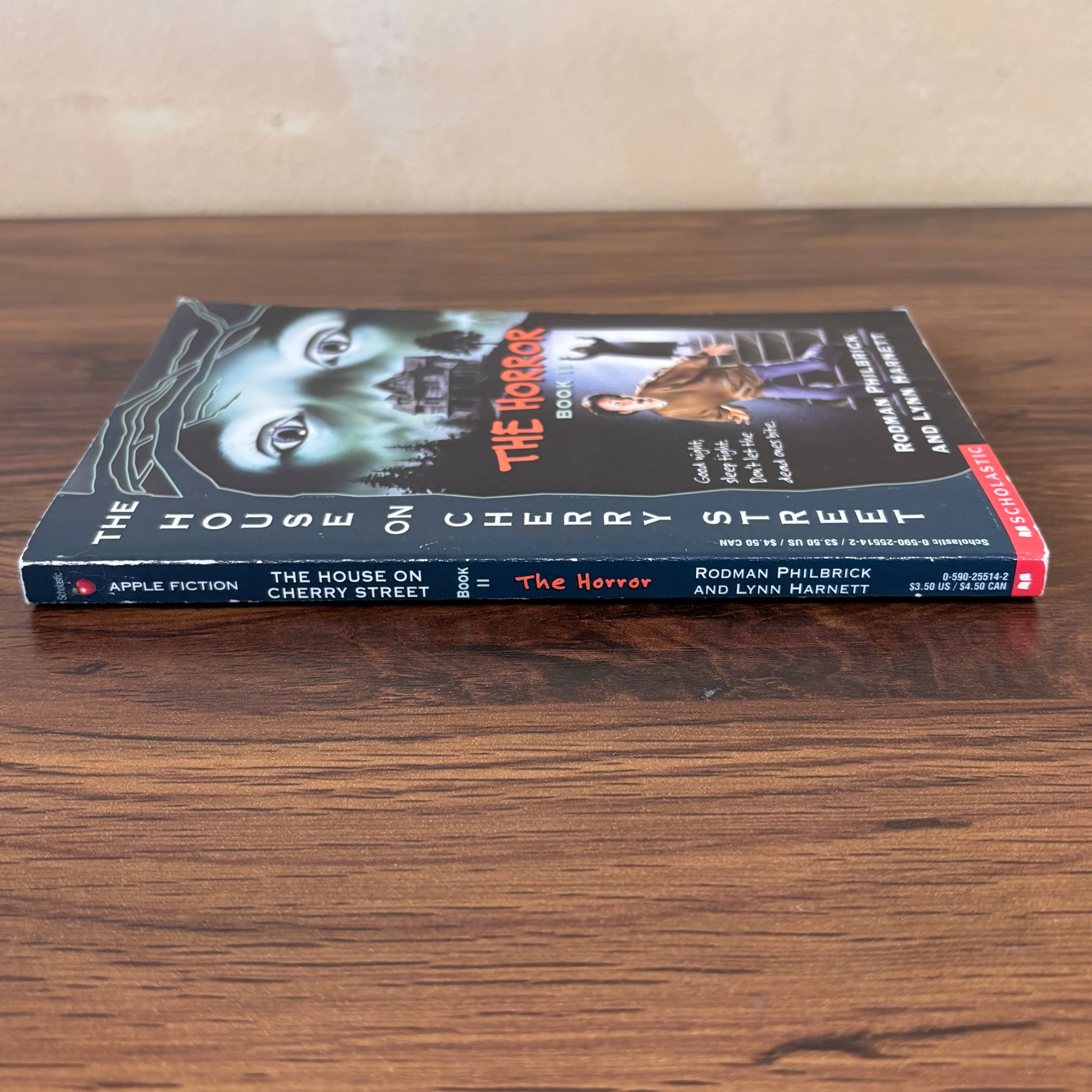 The Horror Book II from The House on Cherry Street series, a scary kids paperback with creepy house artwork, babysitter suspense, and nostalgic Scholastic book fair vibes.