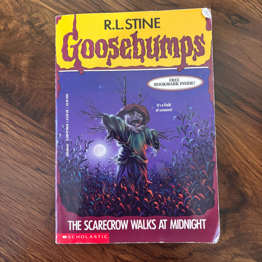 The Scarecrow Walks at Midnight by R.L. Stine - Goosebumps 1993. A chilling horror story from the classic series, partial ad intact. Perfect for collectors and fans of the series.