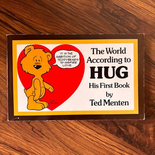 The World According to HUG by Ted Menten. This sweet softcover cartoon book is filled with cozy bear wisdom, charming illustrations, and feel-good 80s vibes