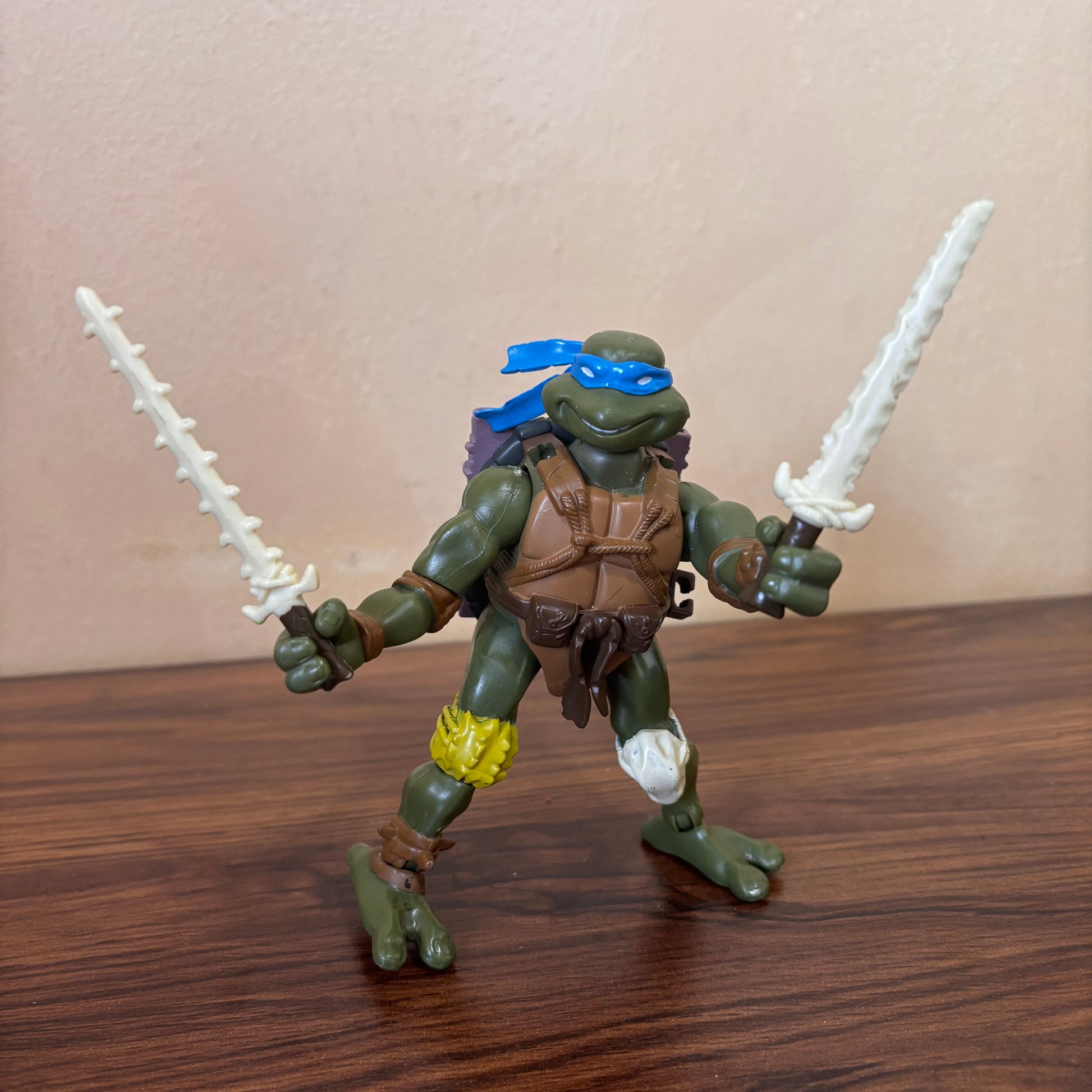 TMNT 2005 Paleo Patrol Leo action figure, Jurassic Age Leonardo design, collectible Teenage Mutant Ninja Turtles toy, great for fans and collectors.