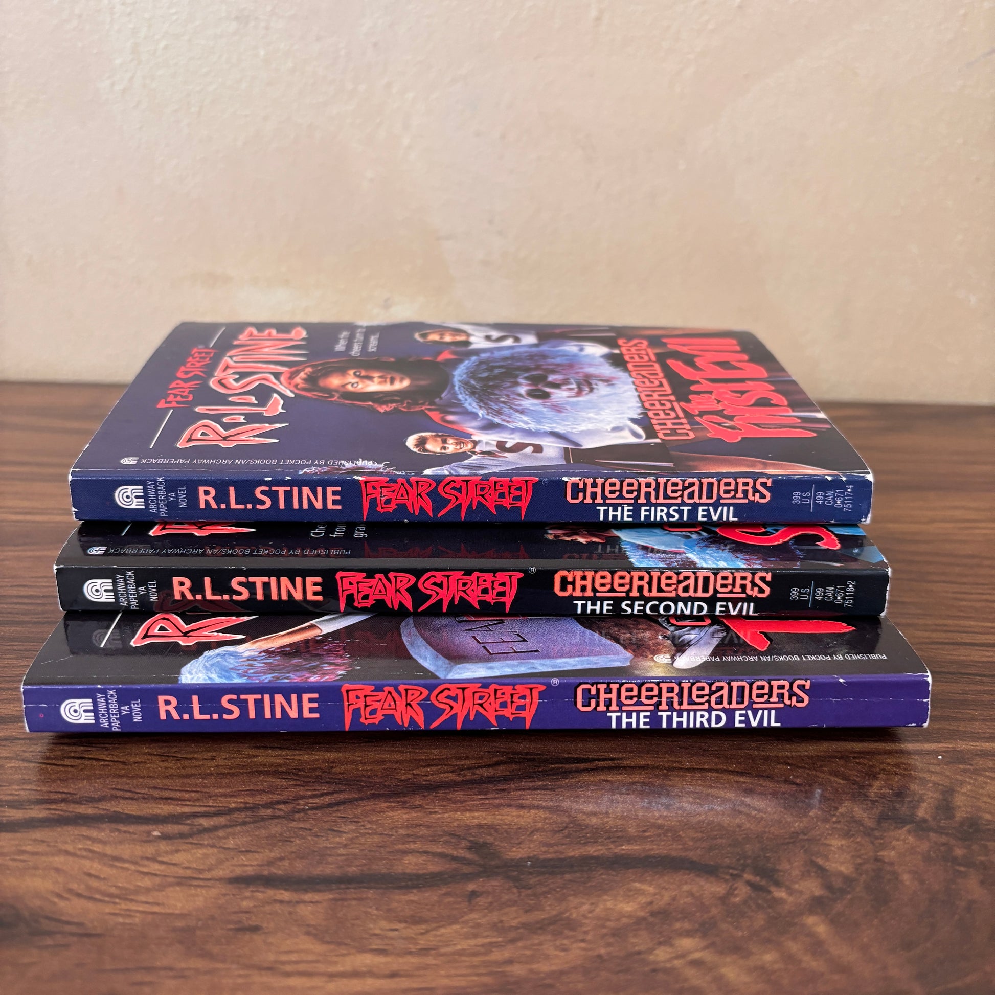 Vintage Fear Street Cheerleaders trilogy by R.L. Stine shown as a three book paperback set with original cover art, a nostalgic 90s teen horror collectible for fans of retro YA thrillers.
