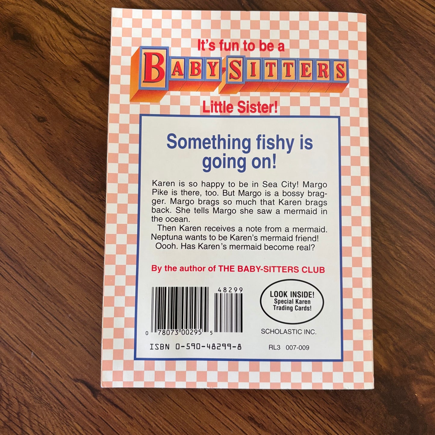 Vintage Karen’s Mermaid Baby-Sitters Little Sister paperback book by Ann M. Martin with collectible cards inside, a nostalgic Scholastic children’s book for fans of 90s girls series fiction.