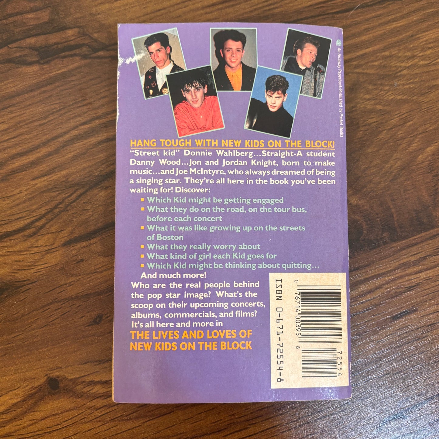 Vintage New Kids on the Block paperback book with bonus photo album, a nostalgic NKOTB collectible for fans of 90s pop music, boy bands, and retro music memorabilia.