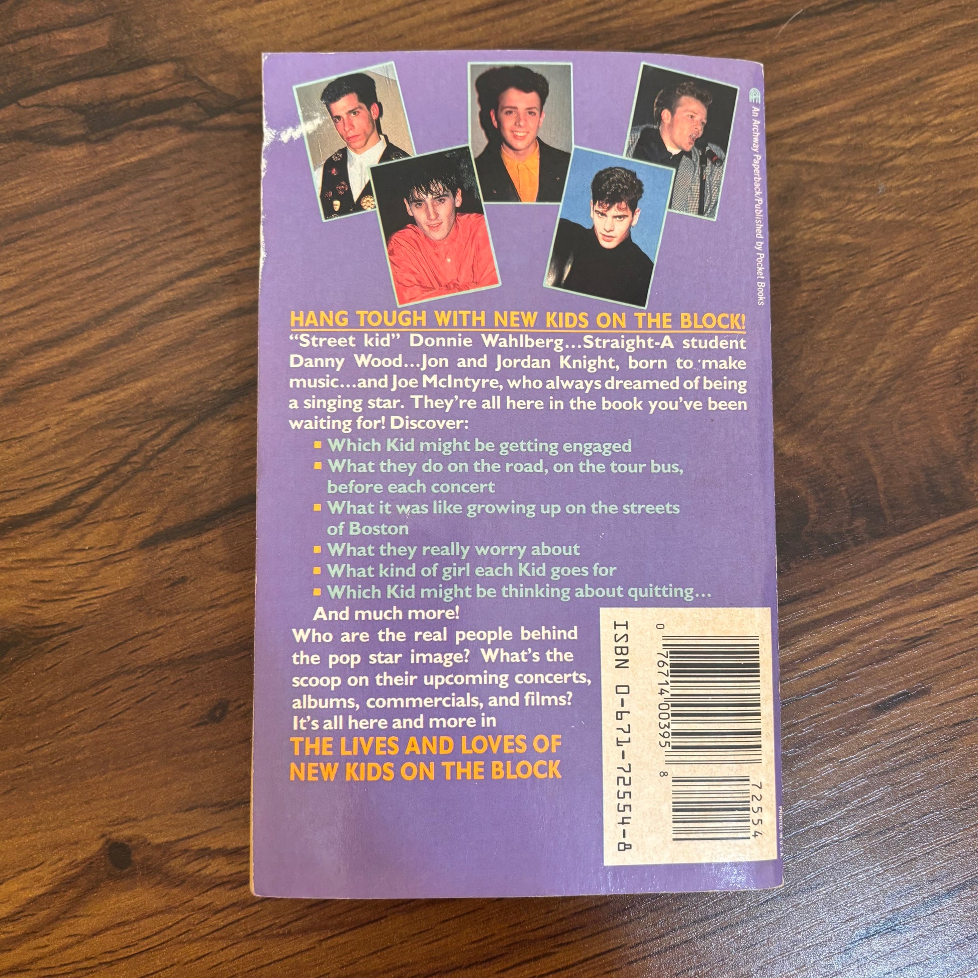 Vintage New Kids on the Block paperback book with bonus photo album, a nostalgic NKOTB collectible for fans of 90s pop music, boy bands, and retro music memorabilia.