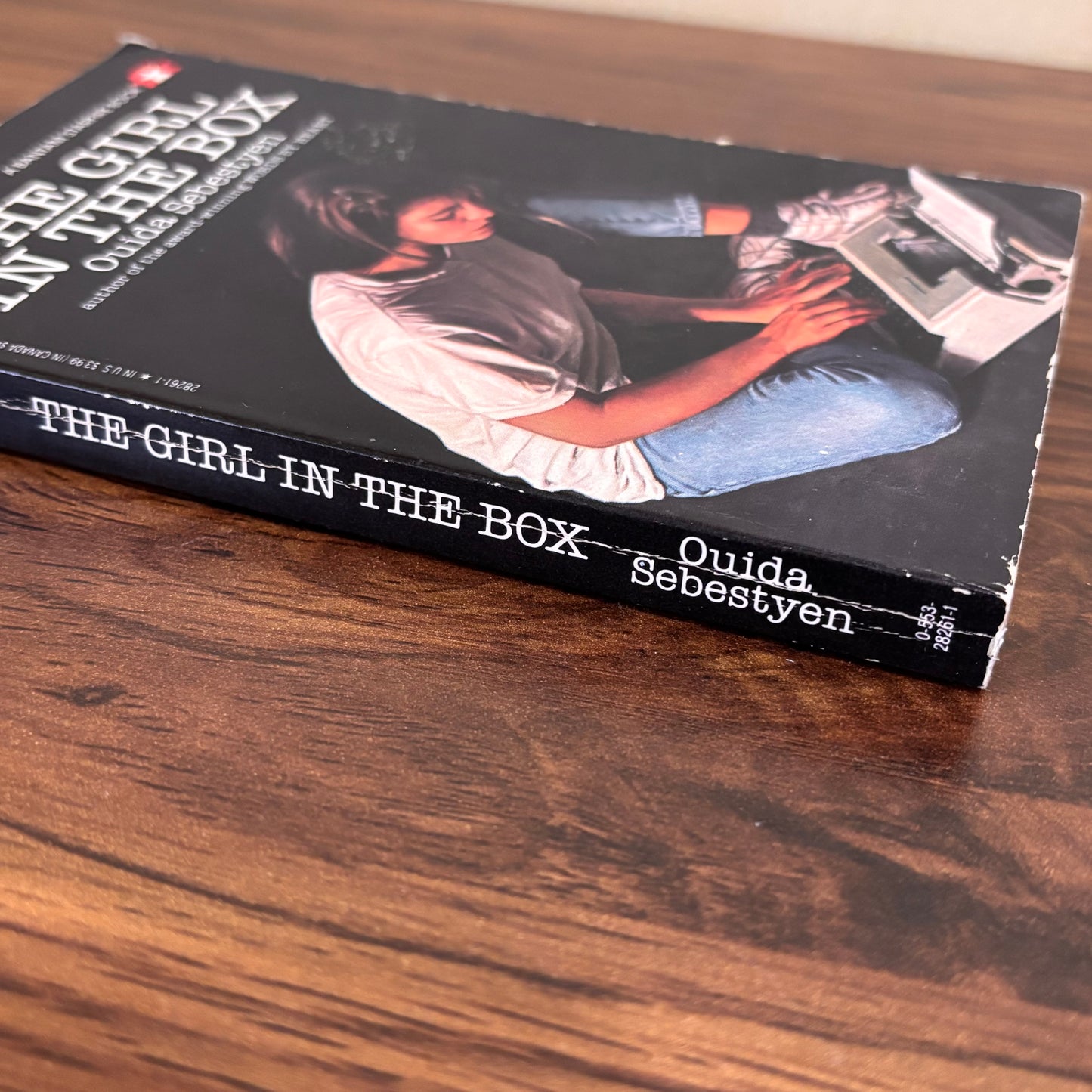 Vintage teen book about a kidnapped girl kept in an underground box, The Girl in the Box by Ouida Sebestyen, a haunting YA story of fear, resilience, and hope.